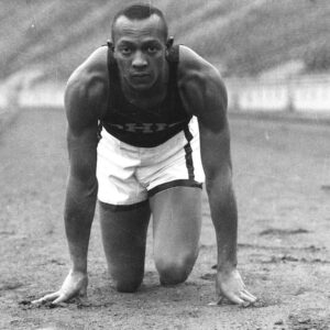 Jesse Owens' Performance At The 1936 Berlin Olympics Showcased His Remarkable Athletic Prowess And Resilience.